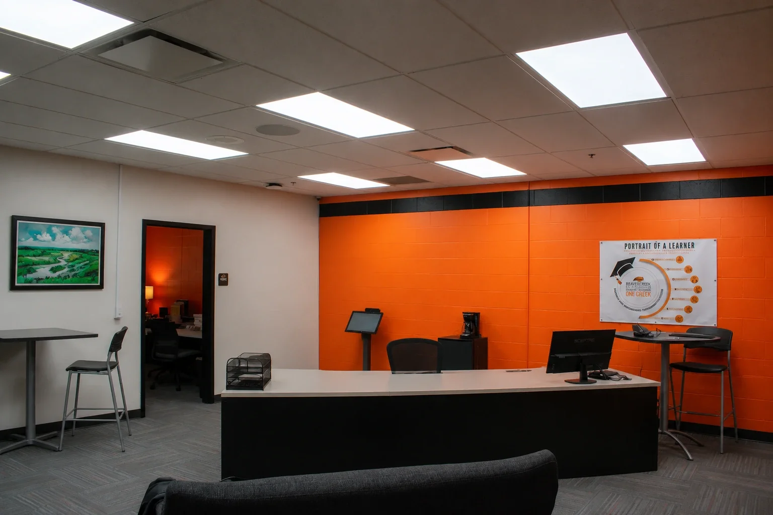 Freshly painted orange and black walls and new flat-panel ceiling lights in the renovated Beavercreek High School administrative suite